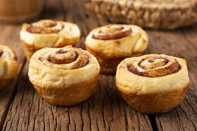 Cinnamon rolls on wooden background.