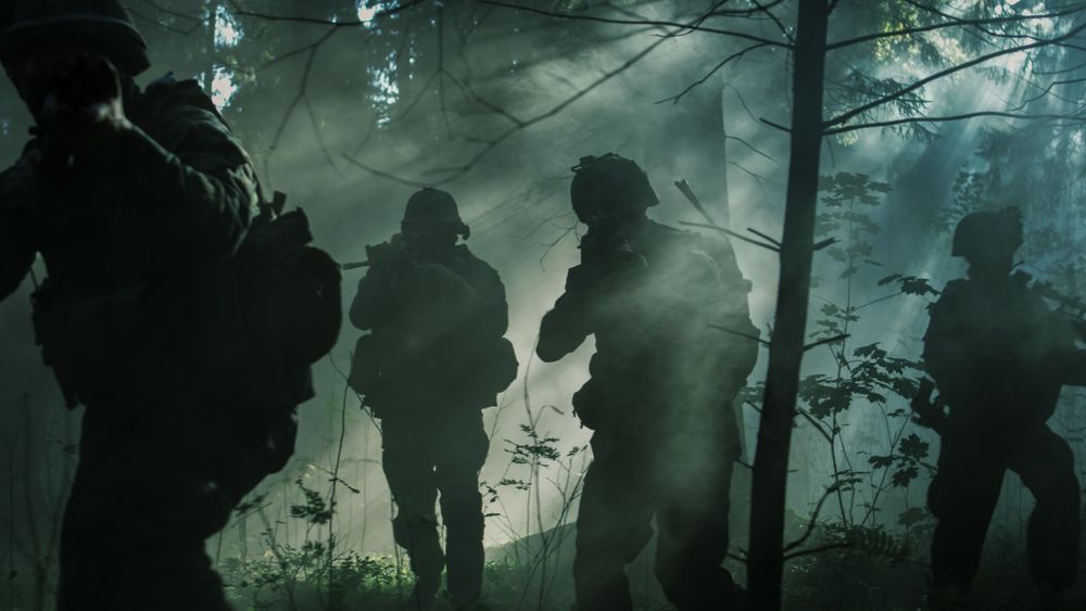 Squad of Five Fully Equipped Soldiers in Camouflage on a Reconnaissance Military Mission
