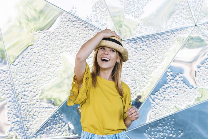 Stylish woman posing in straw hat