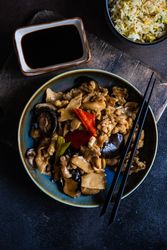 Chinese stir fry served with bowl of egg fried rice