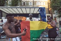 London, England, United Kingdom - August 25th, 2019: Group of people holding Guinea-Bissau flag bDjMy5