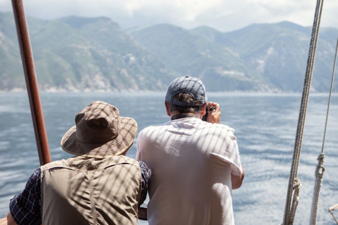 Men against pictures seashore view in mist