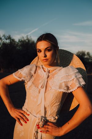 Woman in dress posing on nature