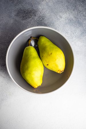 Top view of pears in grey bowl
