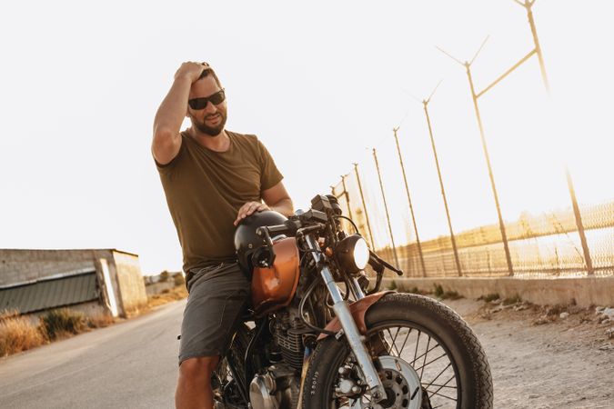 Strong man driving motorcycle