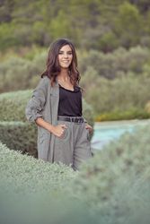 Elegant woman standing in countryside