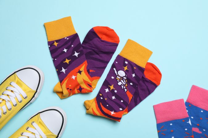 Casual clothes and wearing concept - socks, clothes for foot