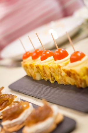 Spanish omelet tapas and cheese with onion pinchos