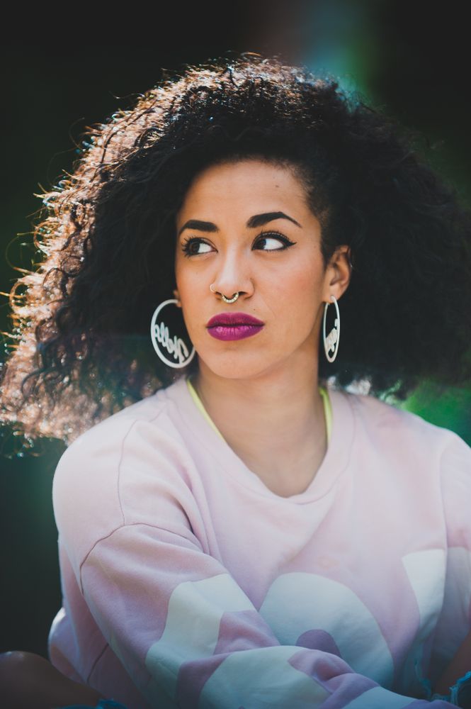Portrait of modern Black woman with curls