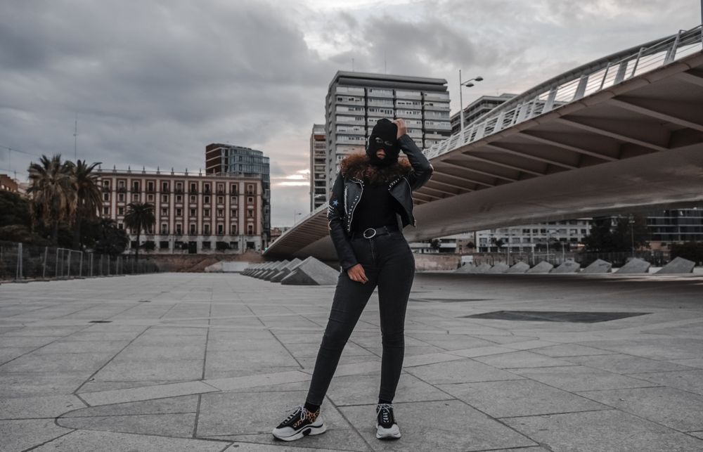 Woman in balaclava and leather jacket