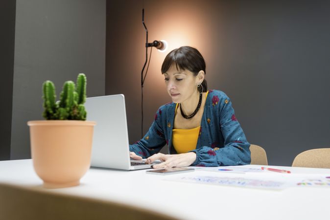 Woman using laptop in office