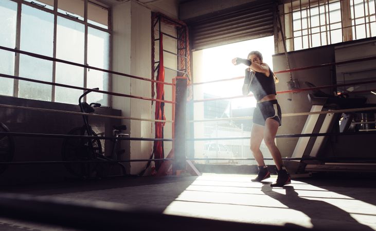 Female boxer inside a boxing ring