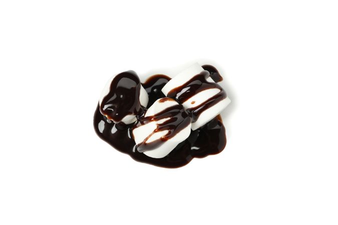 Marshmallow in chocolate sauce isolated on plain background