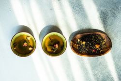 Top view of tea time concept with green tea and chopsticks