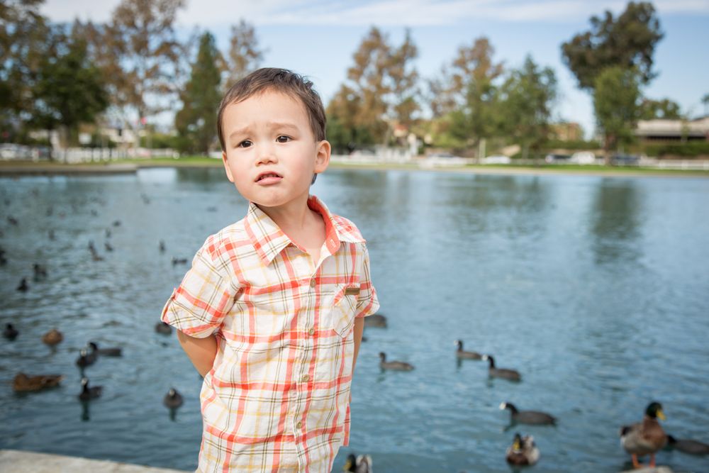 Biracial Boy Having Fun at the Pond
