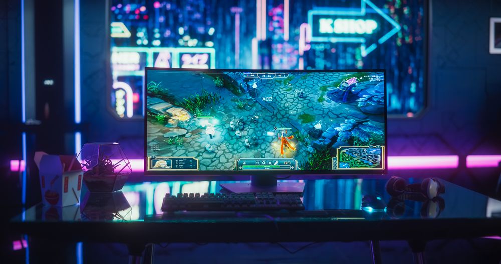Empty Gaming Space with Computer Screen Showing Fantasy RPG Strategy Video Game.