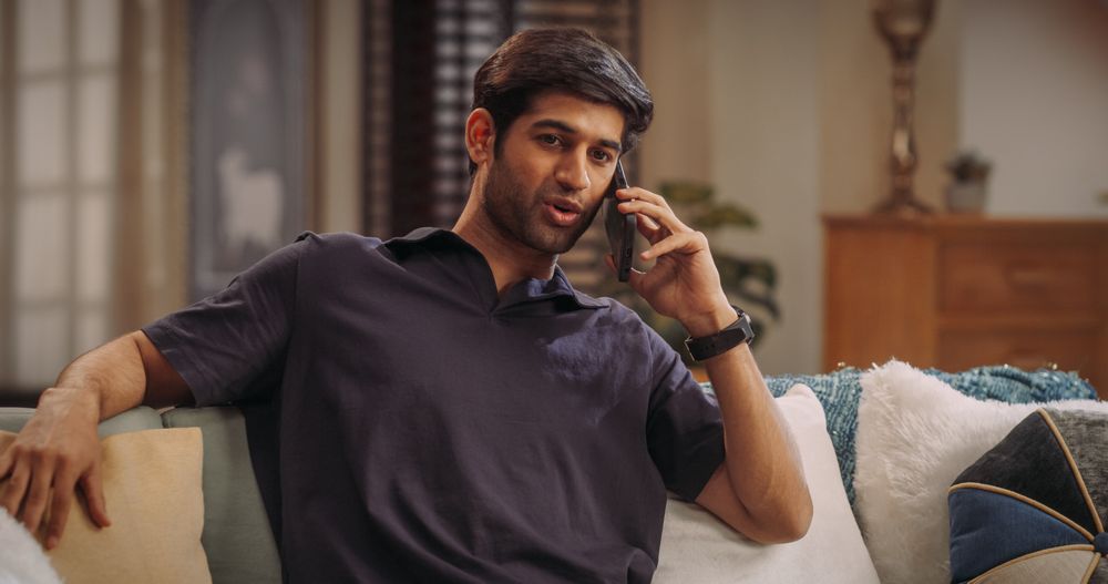 Young Indian Man Talking On His Smartphone, As He Shares His Entrepreneurial Skills with World Of E-Commerce.