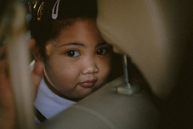 Girl sitting in the back seat in close-up