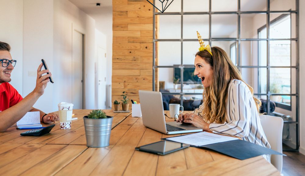 Funny business woman with unicorn headband surprised