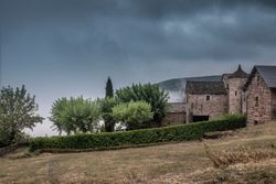 Traditional stone house in French village on over cast day