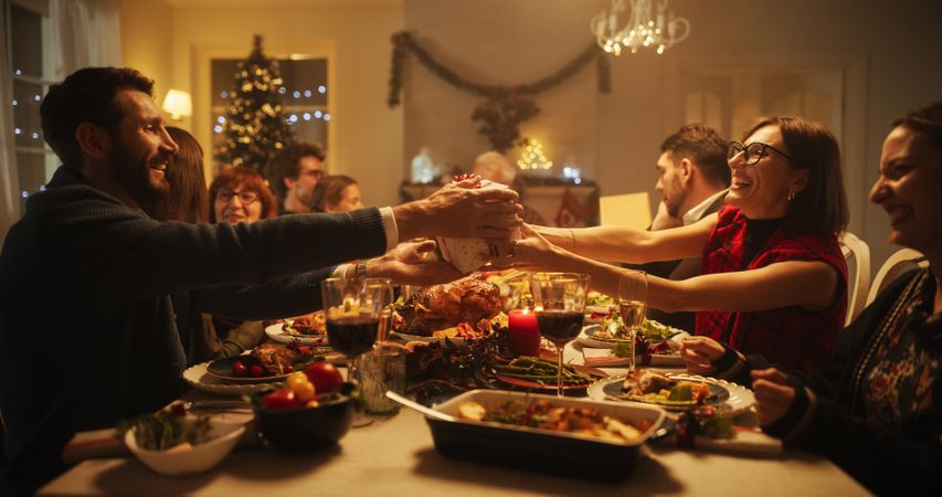 Big Diverse Family Exchanging Christmas Gifts to Celebrate the Holiday.
