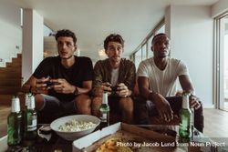 Friends intently playing video games 41pr85