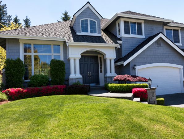 Freshly cut front yard of clean home