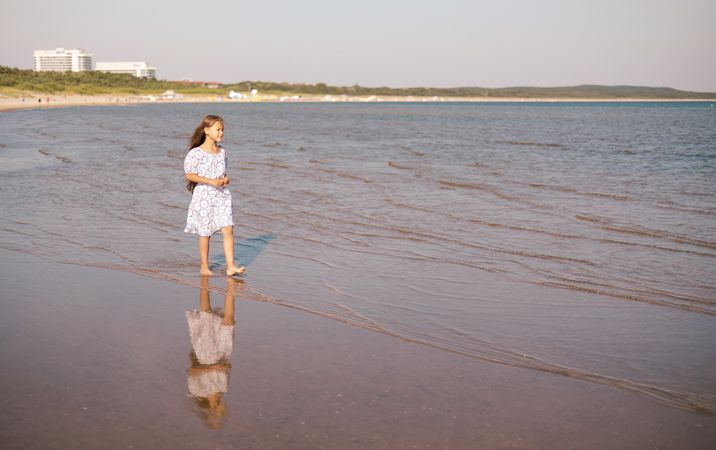 Child girl with long hair outdoors