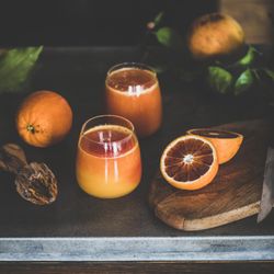 Two glasses of freshly squeezed blood orange juice, square crop