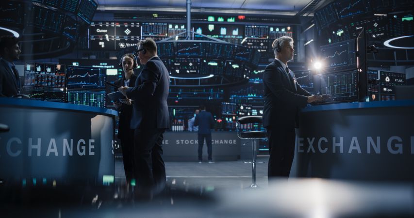 Professional Diverse Team of Male and Female Traders Working at a Modern Stock Exchange Company.