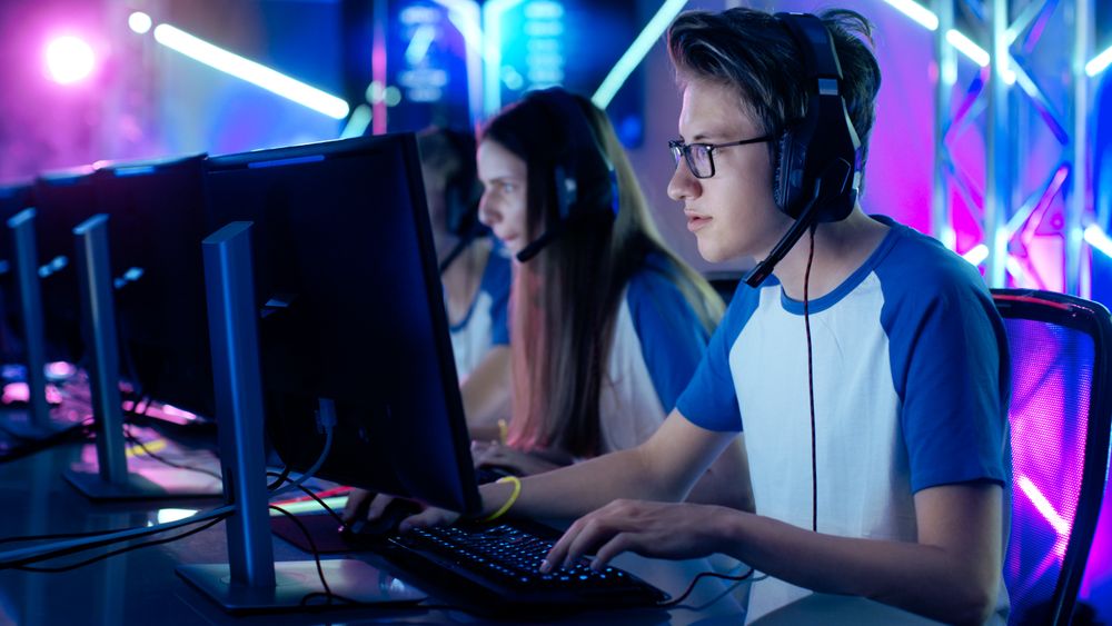 Team of Professional Cybersport Gamers Playing Video Games on a Cyber Games Tournament.