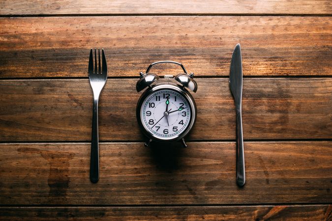 Cutlery near alarm clock