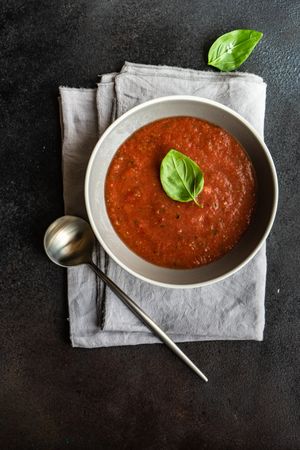 Traditional Spanish gazpacho with basil leaves