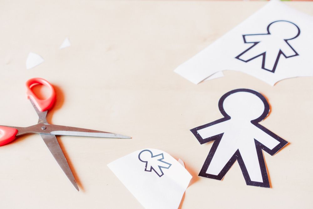 Funny paper toys near scissors