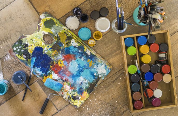 High angle view of brushes, pallete, oils, acrylics and other el