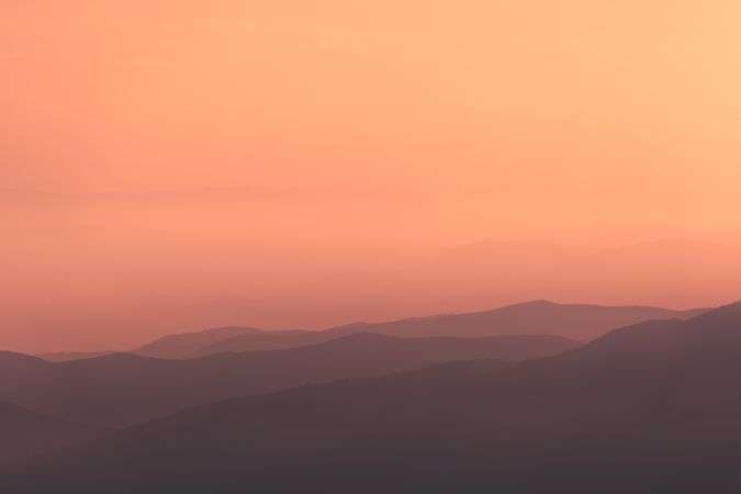 Sunset sky over mountain ridge