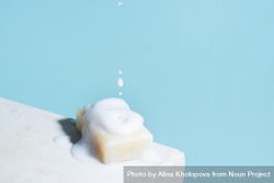 Piece of soap and falling foam, minimal composition bYpj64