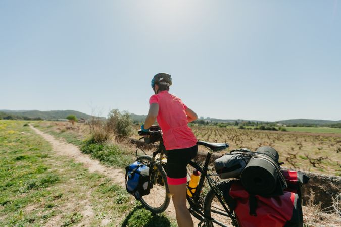 Woman riding bicycle in forest