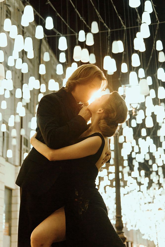 Man and woman about to kiss outdoor