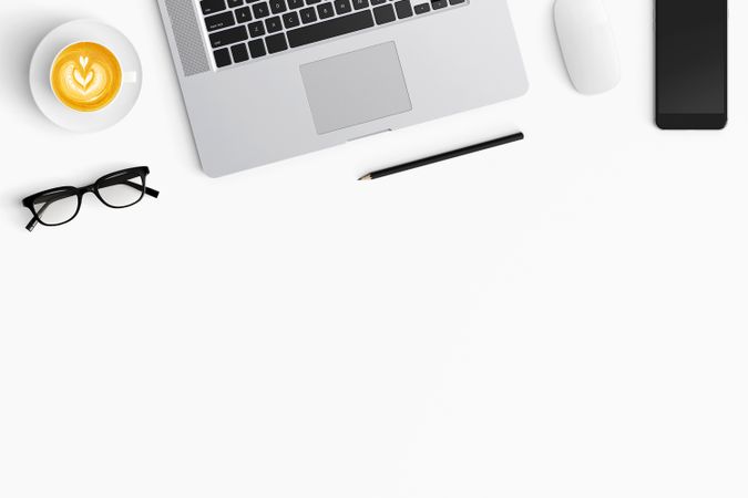 Modern workspace with coffee cup, smartphone, paper, notebook, tablet and copy space
