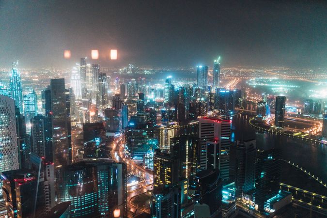 Cloudy sky over illuminated metropolis