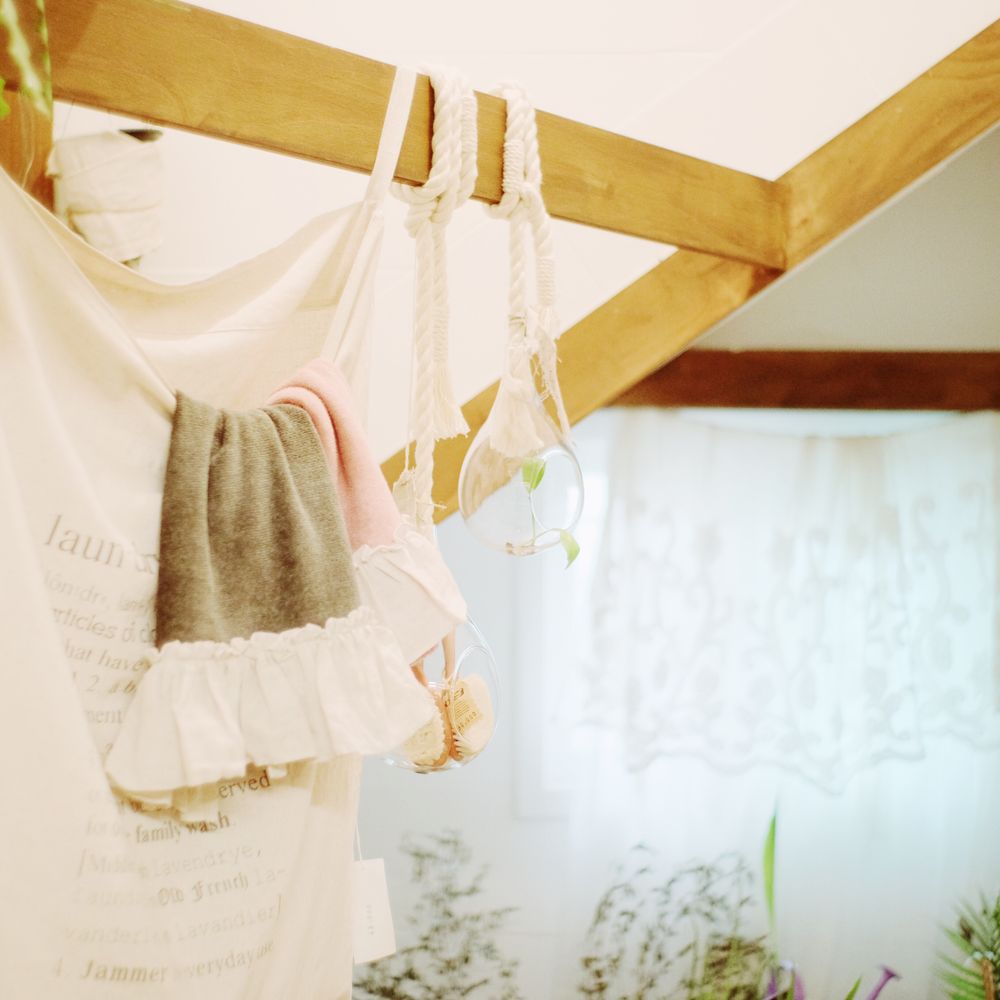 Towels in a bag hanging from ceiling