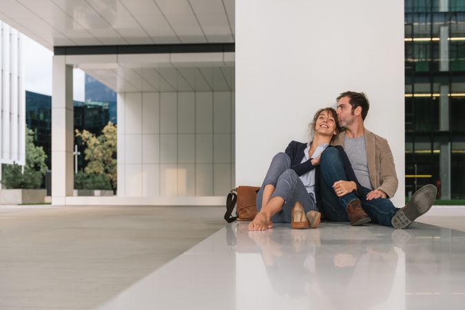 Businesspeople resting outside modern building