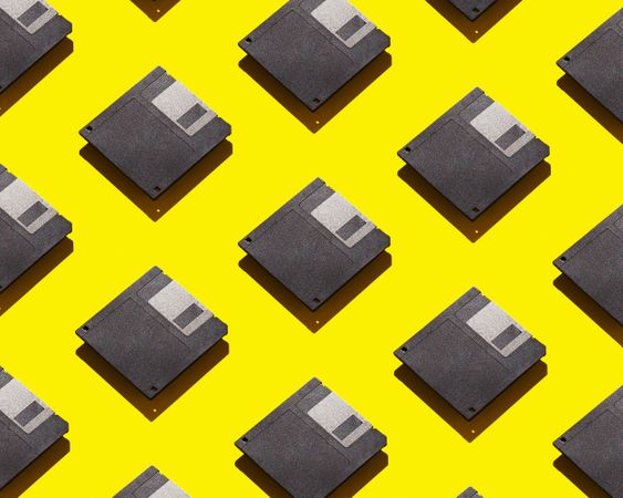 Floppy disks over yellow background