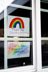 Close up of two handmade signs showing gratitude to essential workers during quarantine
