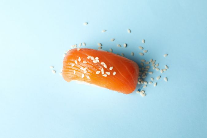 Sushi roll on blue background, top view. Japanese food