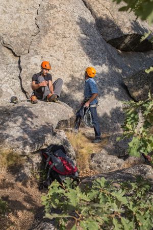 A rock climber is preparing to start climbing