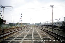 Train tracks and signals on overcast day bxevy0