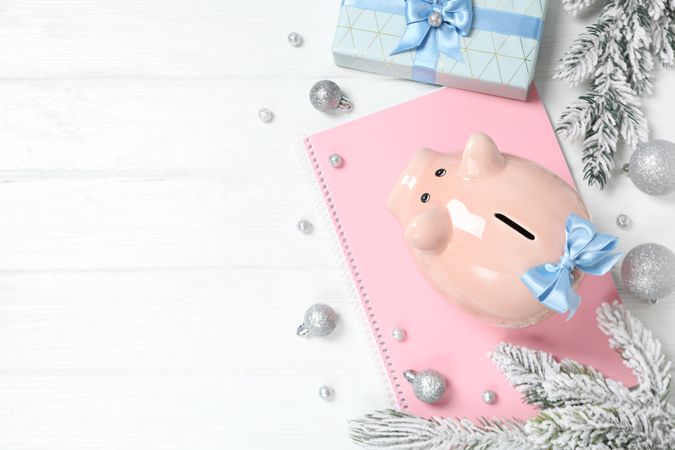 Concept of Christmas finance with piggy bank, space for text