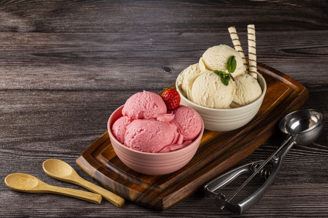 Bowls with strawberry and vanilla ice cream.